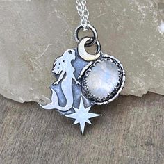 Handmade with sterling silver and brass (the moon) mermaid pendant with moonstone  The size is aprox 2.5cm high (plus jump rings) x 1.8cm width. Pendant deeply oxidized and polished. Chain length- 45cm *Metal: 100% Sterling silver (0.925) *Jewellery will be sent to you in a jewelry eco-box ♻️ *Free next day shipping via tracked delivery 📦  *All  jewelry is made by me in my small studio situated in Redhill, UK. If you have any questions please don't hesitate to contact me 🫶. Thank you for stopp Magical Moon Shaped Sterling Silver Necklace, Magical Moon-shaped Sterling Silver Necklace, Magical Silver Moon Jewelry, Celestial Silver Labradorite Jewelry, Hand Forged Sterling Silver Celestial Necklace, Magical Silver Jewelry With Sun And Moon Design, Magical Silver Moon Phase Jewelry, Silver Labradorite Jewelry With Moon Charm, Celestial Silver Labradorite Necklace