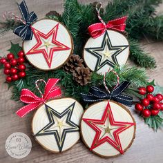 christmas ornaments made out of wood and decorated with stars