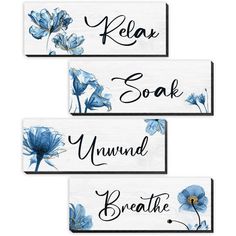 three wooden signs with blue flowers on them