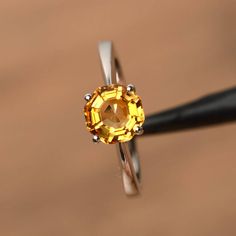 It is a natural citrine ring, octagon cut, measures 7mm*7mm, weight about 1.46 cts. The basic metal is sterling silver and plated with rhodium.To change the metal to a solid gold (white/rose) or platinum is also available, please ask for a quotation if you want.You can also go to my shop Home for more elegant rings: https://www.etsy.com/shop/godjewelry?ref=hdr_shop_menuMore citrine rings:https://www.etsy.com/shop/godjewelry?ref=seller-platform-mcnav&search_query=citrineCustomization is alway Yellow Topaz Solitaire Ring In Citrine, Fine Jewelry Yellow Faceted Ring, Yellow Faceted Fine Jewelry Rings, Yellow Octagon Ring For Anniversary, Yellow Octagon Anniversary Ring, Octagon Citrine Gemstone Ring, Yellow Citrine Solitaire Birthstone Ring, Octagon Shaped Sterling Silver Topaz Ring, Polished Yellow Topaz Round Ring