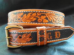 This classic oakleaf design has been carved on cowboy belts since cowboys were invented. The beautiful oak leaves are deeply tooled against a dark brown hand painted background. Heavy white harness thread stitching adds wow factor. Classy, beautiful and made to last forever. Features: - deeply tooled oak leaf pattern - hand painted with stitched border - premium Hermann Oak belt leather 1 1/2 inches wide - antique solid brass buckle with snaps (easy to change buckles) - personalized with 2 initi White Harness, Oak Leaf Pattern, Cowboy Belts, Nice Belts, Cowboy Belt, Painted Background, Brown Hand, Western Belt, Belt Leather