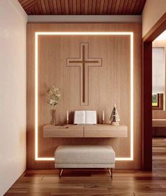 a wooden wall with a cross on it and a bench in front of the alter