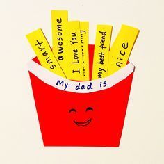 a red bucket filled with yellow stickers and some writing on it's side