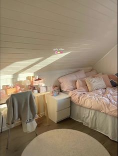 an attic bedroom with a bed and desk