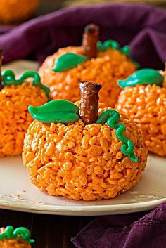 pumpkin rice krispy treats on a white plate