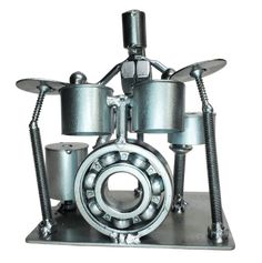 Looking for a unique way to enhance your office or Music cave? Consider this one-of-a-kind metal art Drummer! It's the perfect gift for any Drum Head or Music buff! Each piece is hand-crafted using sprockets, chains, nuts, bolts, washers, springs, and bearing wheels, making it a truly one-of-a-kind present. For exact measurements, check out the photo. You can find these METAL artwork pieces at our Smyrna store, located just minutes from Nashville, TN. Welding Crafts Junk Art, Hardware Art, Novelty Decor, Welding Crafts, Music Project, Drum Head, Nuts Bolts, Metal Garden Art, Junk Art