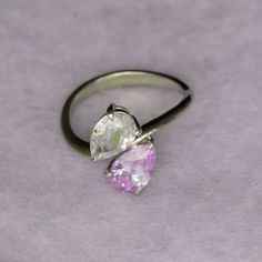 Our two stone pear engagement ring is also known as a "Toi et Moi" ring, which translates to "you & me"; a lovely sentiment for an engagement ring! The two stone ring style is very popular with quite a few celebrities choosing this style. Featuring lavender & white Cubic Zirconia pear shape stones and nickel free, recycled sterling silver. Contact us to personalize with any gemstone or birthstone.A very unique engagement ring for anyone looking for different! The style is modern, yet classic, wi Pear-shaped Solitaire Cubic Zirconia Ring, Cubic Zirconia Pear-shaped Promise Ring, Diamond White Solitaire Teardrop Ring, Anniversary Teardrop Cubic Zirconia Ring, Diamond White Teardrop Ring For Promise, Pear Shaped Cubic Zirconia Anniversary Rings, Teardrop Vvs Clarity Ring For Promise, Pear-shaped Cubic Zirconia Rings For Anniversary, Teardrop Cubic Zirconia Jewelry For Proposal