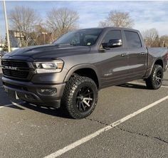 a gray ram truck parked in a parking lot