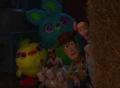 the characters from toy story are posed in front of hay bales and stuffed animals