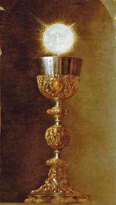 a painting of a golden chalice with a white light shining on it's face