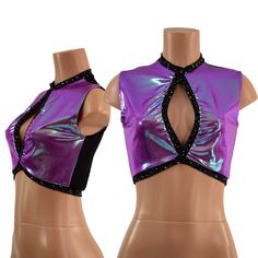 This crop top is made from Plumeria holographic spandex, with star noir trim around the neck, edge, and keyhole.  It has a sheer, black mesh back. Sleeveless, with a keyhole neckline, banded hemline, and four way stretch fit. TOP LENGTH: Underarm to hemline measures 8" This item is made to order. Ships out within 5 days of purchase. Womens Sizing (See below for instructions on where measurements should be taken) XXS: Bust 29"-30" / Waist 22"-23" / Hips 30"-32" Extra Small: Bust 31"-32" / Waist 24"-25" / Hips 33"-35" Small: Bust 33"-34" / Waist 26"-28" / Hips 36"-37" Medium: Bust 35"-37" /Waist 28"-31" / Hips 38"-40" Large: Bust 39"-41" / Waist 32"-34"/ Hips 41"-43" Extra Large: Bust 42"-44" / Waist 35"-37" / Hips 44"-46" 2XL: Bust 46"-48" / Waist 38"-42" / Hips 48"-50" 3XL: Bust 50"-56" / Purple Crop Top For Night Out, Rave Crop Top For Night Out, Rave Stretch Crop Top For Night Out, Stretch Rave Crop Top For Night Out, Fitted Sleeveless Rave Crop Top, Purple Fitted Crop Top For Club, Fitted Purple Crop Top For Club, Purple Stretch Club Top, Purple Stretch Tops For Club