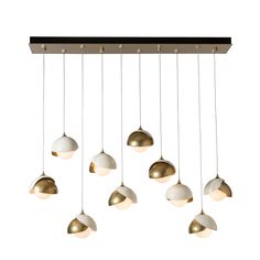 six lights hanging from the ceiling with different shades of white, gold and black on them