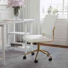 a white office chair sitting in front of a desk with a vase on top of it