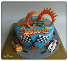 a birthday cake for a boy with cars on it