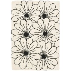 a rug with black and white flowers on it