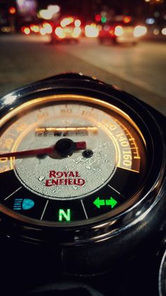 a close up of a speedometer on the road