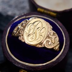 This gorgeous antique signet ring features an oval face with an engraved set of initials, possibly "PDL".  The shoulders are beautifully covered with scroll work.  It is crafted in 10k yellow gold and is currently a size 7.5. Scroll Work, Oval Face, Gold Signet Ring, Oval Faces, Signet Ring, Initials, Jewelry Rings, Size 7, Yellow Gold