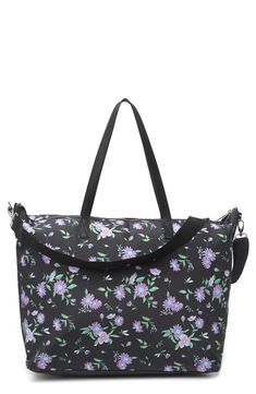 Pack up for your next getaway in style in this sleek tote bag. 13" H x 17" W x 7.5" D; 10" handle drop; 10-20" shoulder strap drop Dual top handles Single detachable, adjustable shoulder strap Top zip closure Exterior features front zip pocket Interior features 1 wall zip pocket and 2 wall slip pockets Polyester and PU trim exterior, polyester lining Imported Pack Up, Strap Top, Madden Girl, Strap Tops, Black Floral, In Style, Diaper Bag, Zip Pockets, Shoulder Strap