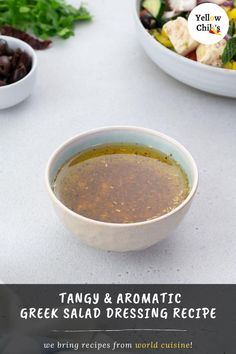 there is a bowl of soup on the table next to bowls of vegetables and salad