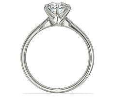 a diamond engagement ring on a white background