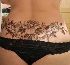 a woman's stomach with flowers on it