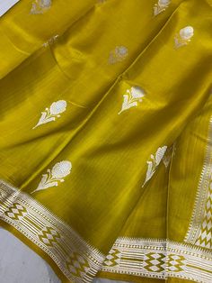 This is a very beautiful pure banarasi mashru silk handloom saree . All over kadhuwa weave and bootis. rich pallu with blouse piece.  Saree length - 5.5 mtr. Blouse - 1 mtr.  Dry clean only . Please note - color may be vary a little due to sunlight and photography . Please message us after purchasing in case you want fall and Pico done it not . No extra charges for fall and Pico but inform us . Blouse stitching is also available . Handloom Anarkali Dupatta In Paithani Silk, Anarkali Paithani Silk Handloom Dupatta, Anarkali Handloom Paithani Silk Dupatta, Bollywood Style Yellow Dupatta With Weaving Work, Festival Katan Silk Dupatta With Handloom Details, Festive Slub Silk Dupatta With Zari Weaving, Festive Katan Silk Dupatta With Handloom Details, Handloom Slub Silk Saree For Diwali, Paithani Silk Handloom Saree For Eid