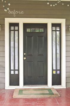 a black front door with the words blue house gray door on it