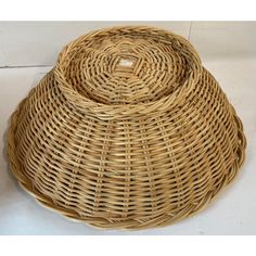 a round wicker basket on a white background