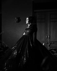 black and white photo of woman in evening gown