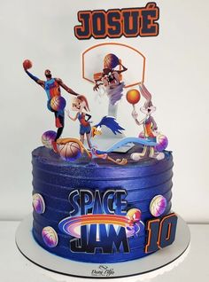 a birthday cake with the name space jam on it and some basketball players around it