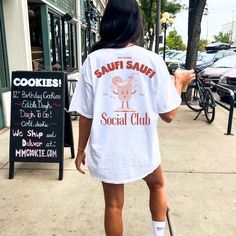 Saufi Saufi Social Club Cocktail Party Shirt Malle 2024 spring break Back print Mallorca Holiday Group Girls Trip Company Party personalized ♡ The color "NATURAL" is not bleached and it is natural structure so it appears to have tiny brown dots all over ♡ For an oversized look like on the picture, order 2 sizes bigger than usual and please check the size chart to be sure which size is best for you ♡ The classic fit along with the crew neckline deliver a comfy wearing experience with a clean-cut Feminist Gift, Negroni, Club Shirts, Retro Shirts, Social Club, Party Shirts, Oversized Shirt, Girls Trip, Cut And Style