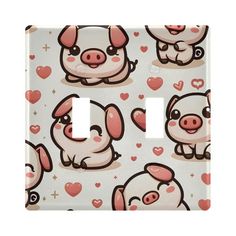 a light switch cover with pigs and hearts on it