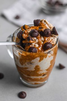 a dessert in a glass with chocolate chips on top