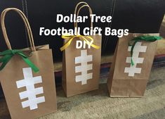 three brown paper bags with white crosses on them and the words dollar tree football gift bags diy