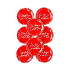 six red plates with the words santa and other christmas sayings on them, arranged in a pattern