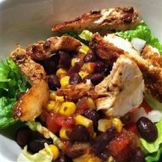 a salad with chicken, black beans and corn