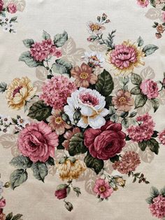 an image of a flowered fabric with pink and yellow flowers on it's side