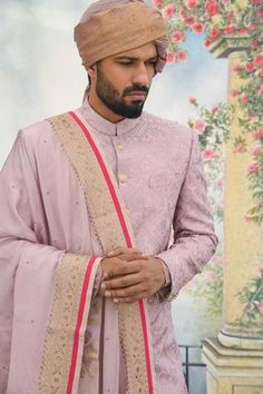 Pink sherwani with thread embroidered motifs and welt pocket. Comes with kurta, churidar and embroidered shawl.
Component: 4
Pattern: Embroidery
Type Of Work: Thread
Neckline: Band
Sleeve Type: Full
Fabric: Silk
Color: Pink
Other Details: 
Front and side slits
Buttoned cuffs
Shawl with embroidered border
Closure: Button front
Note: Turban/safa worn by the model is not for sale
Occasion: Groom - Aza Fashions Designer Bandhgala With Dupatta For Eid, Designer Sherwani With Dupatta For Festive Occasions, Designer Kurta With Dupatta For Diwali, Designer Kurta With Dupatta For Eid, Designer Jamawar Traditional Wear For Eid, Designer Eid Dupatta Traditional Drape, Pink Sherwani, Embroidered Shawl, Pink Thread