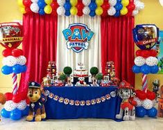 a birthday party with balloons and decorations for paw patrol themed children's birthday party