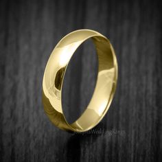 A beautiful classical wedding band made out of solid 9K or 18K Gold, simple in designed dome shaped and 2-7mm Wide wedding band finished with a shiny polish. * MATERIALS: 9K, 14K or 18K Gold (Your Choice of Colour) * DIMENSIONS: 2-7mm Wide  * Tested Fineness Stamp: 375 (=9K) / 750 (=18K) & Workshop Stamp * Inside Ring Flat Profiled * NOT GOLD PLATED (Real Solid Gold) * Handmade On Order * This band is of standard Gold Weight construction * FREE Royal Mail Special Delivery & Tracked International Classic Yellow Gold Wedding Band, Classic Polished Dome Ring For Wedding, Classic Dome Ring With Polished Finish For Wedding, Polished Domed Dome Ring For Wedding, Classic Gold Oval Couple Rings, Classic 14k Stamped Couple Rings For Wedding, Classic Couple Rings Stamped 14k For Wedding, Classic 14k Gold Couple Rings For Wedding, Classic 14k Gold Couple Rings For Marriage