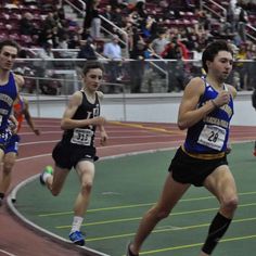 the men are running on the track together