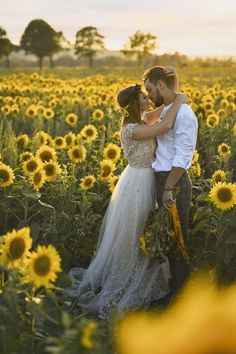 a bride and groom kissing in a sunflower field