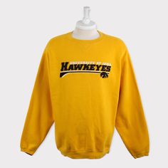 Embroidered Vintage 90s Iowa Hawkeyes Sweatshirt Iowa University Iowa Hawkeyes Football Sweater Crewneck Hoodie Jacket T Shirt Hat Gift Tee 💯 SATISFACTION AND AUTHENTICITY ⭐ MEASUREMENTS (when laid flat) Size on Tag: L (fit XL) Length: 77cm or 30.5 inches Armpit to armpit: 64cm or 25 inches ⭐ CONDITION 9/10 (Very good) Details: No holes Material: Cotton Color: Yellow Brand: Varsity Iowa Hawkeyes Shirt, Iowa Hawkeyes Football, Iowa University, Iowa Hawkeye Football, Hawkeye Football, Football Sweater, Iowa Hawkeyes, Sweaters Crewneck, Star Shirt