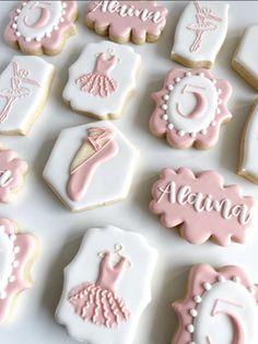 decorated cookies are arranged in the shape of baby's first names and other items