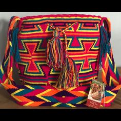 Handcrafted By Indigenous From The Guajira Colombiana, Each Bag Is Unique And The Time To Elaborated Is Between 20 To 30 Days. Pink Backpack For Vacation, Rectangular Purple Crochet Bag For Travel, Purple Rectangular Crochet Travel Bag, Rectangular Purple Crochet Travel Bag, Casual Handmade Purple Bags, Casual Handmade Purple Shoulder Bag, Multicolor Rectangular Backpack For Festivals, Multicolor Rectangular Festival Backpack, Purple Bag With Adjustable Strap For Vacation