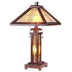 a table lamp with a stained glass shade on the top and bottom part of it