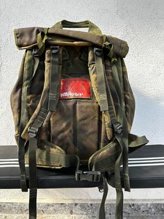 Vintage Military Huge Rucksack Backpack United Kingdom British 1993 Army Soldier Equipment Camouflage Collectible Unique Canvas Backpack Haversack  It has Metal frame  UK  See photos for condition Used by British army Many pockets  Strong durable canvas Military Style Backpack For Adventure, Camouflage Functional Travel Bags, Functional Camouflage Travel Bag, Khaki Backpack For Camping, Military Style Green Backpack, Standard Khaki Backpack For Camping, Khaki Standard Backpack For Camping, Green Military Style Backpack, Functional Khaki Backpack For Camping