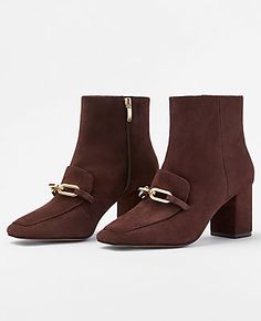 Step out in style with the Ann Taylor Chain Block Heel Suede Booties, a perfect blend of elegance and edge. These chocolate-colored booties are designed to make a statement with their shiny chain embellishments and sleek pointy toe.

- Size: 5
- Color: Chocolate
- Material: Suede
- Gender: Female
- Heel Height: 2 3/4 inches
- Closure: Inside zip
- Features: Padded footbed for complete comfort

Crafted for the fashion-forward woman, these booties offer both stunning looks and unmatched comfort. W Luxurious Chocolate, Knitted Suit, Color Chocolate, Suede Block Heels, Comfort Design, Suede Booties, Office Wear, Modern Woman, Effortless Style