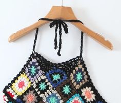 It is time to enjoy the sunshine on beautiful beaches. Are you looking for a top to go with your new denim shorts? Let your free spirit out and go wherever the wind takes you in with our Mahalia Crochet Crop Top! Cute and super soft, this cropped tank is made with cozy crochet fabric. It features beautiful texture and halter ties that can be worn in multiple ways! Specs: Material: Cotton Blend ONE SIZE Fits ALL Bohemian Cotton Tops For Summer Outings, Beach Season Halter Neck Top For Vacation, Summer Halter Neck Beach Tops, Halter Neck Tops For Summer Beach, Beachwear Tops For Summer Beach Season, Trendy Halter Neck Beach Tops, Beachwear Tops For Summer Beach Outings, Beach Season Tops For Summer Outings, Black Top For Beach Party In Spring