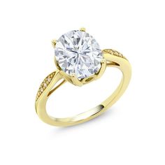 a yellow gold engagement ring with a round cut diamond in the center and pave set shoulders